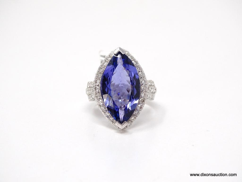 PLATINUM LADIES CAST TANZANITE AND DIAMOND RING.