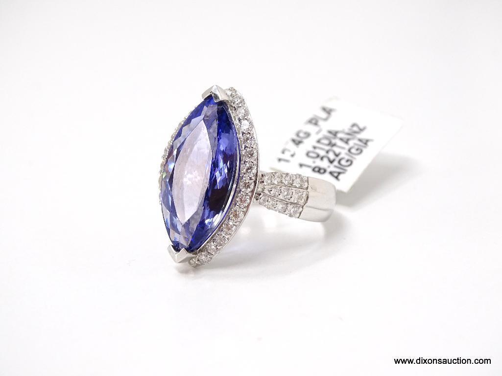 PLATINUM LADIES CAST TANZANITE AND DIAMOND RING.