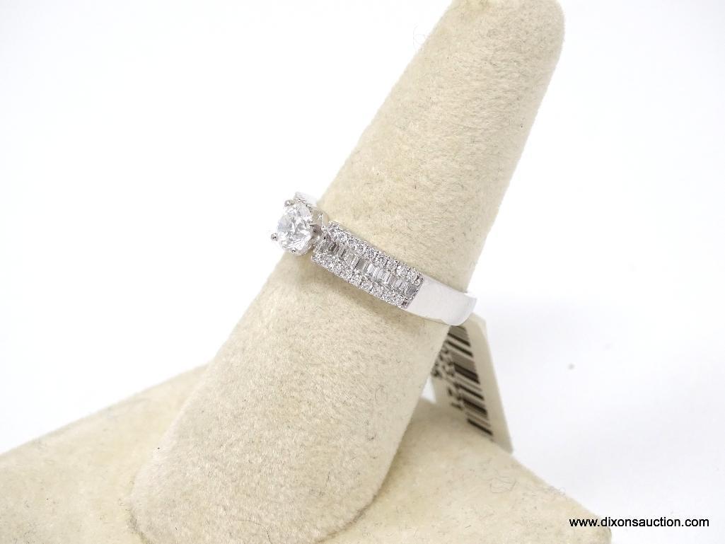 PLATINUM LADIES CAST & ASSEMBLED DIAMOND UNITY RING.