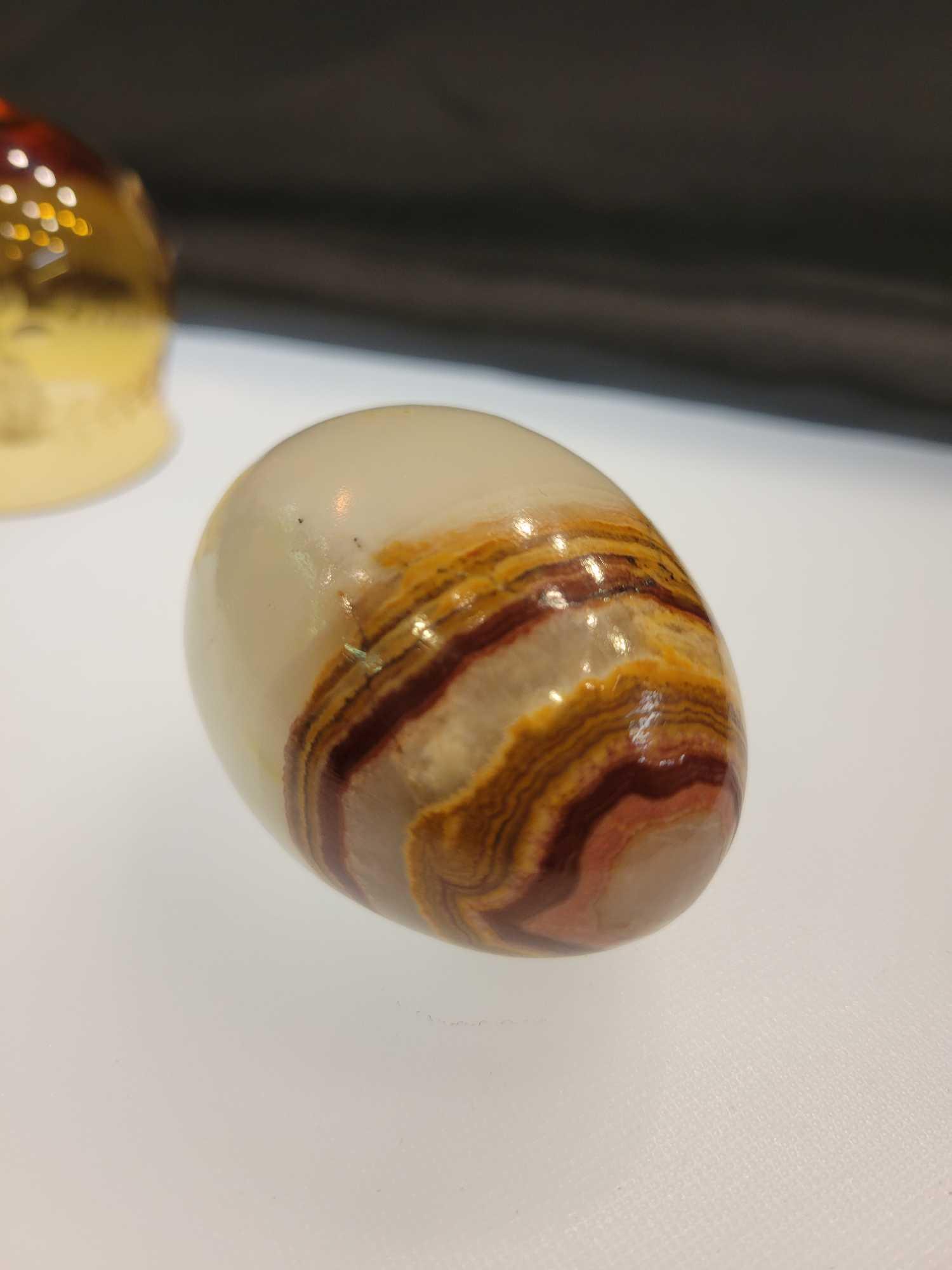 AMBER GLASS BELL AND MARBLE EGG LOT