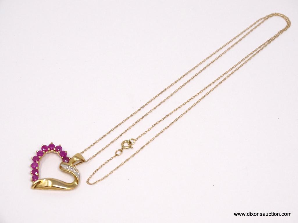 10K YELLOW GOLD RUBY AND DIAMOND HEART PENDANT ON 10K YELLOW GOLD CHAIN. THE PENDANT FEATURES 10