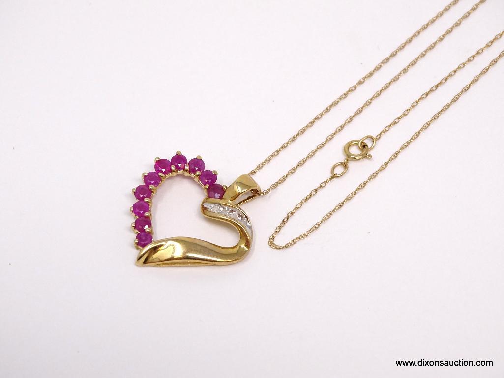 10K YELLOW GOLD RUBY AND DIAMOND HEART PENDANT ON 10K YELLOW GOLD CHAIN. THE PENDANT FEATURES 10