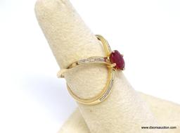 14K YELLOW GOLD RUBY AND DIAMOND X RING. CENTER OVAL CUT PRONG SET 1.03 CARAT RUBY GEMSTONE, WHICH