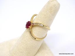 14K YELLOW GOLD RUBY AND DIAMOND X RING. CENTER OVAL CUT PRONG SET 1.03 CARAT RUBY GEMSTONE, WHICH