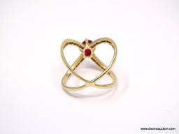 14K YELLOW GOLD RUBY AND DIAMOND X RING. CENTER OVAL CUT PRONG SET 1.03 CARAT RUBY GEMSTONE, WHICH