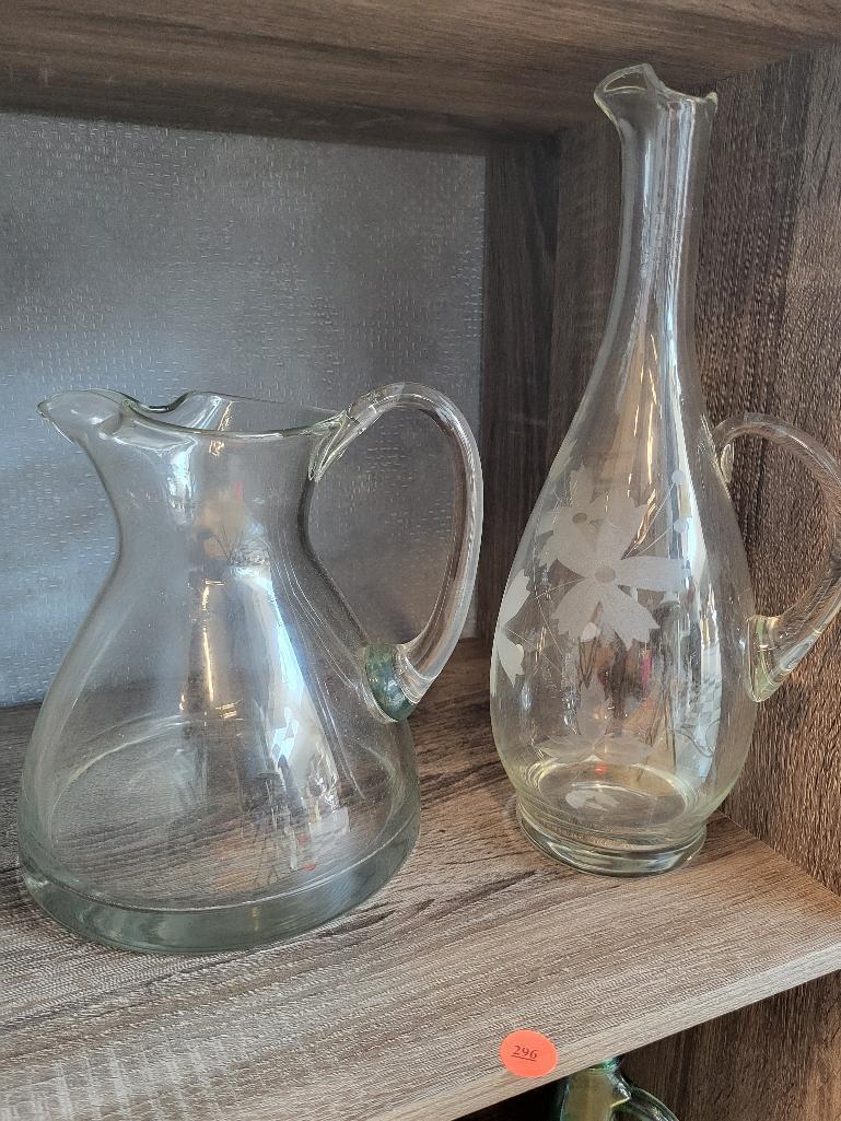 VINTAGE GLASS DECANTER AND WATER PITCHER. IS SOLD AS IS WHERE IS WITH NO GUARANTEES OR WARRANTY, NO