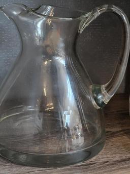VINTAGE GLASS DECANTER AND WATER PITCHER. IS SOLD AS IS WHERE IS WITH NO GUARANTEES OR WARRANTY, NO