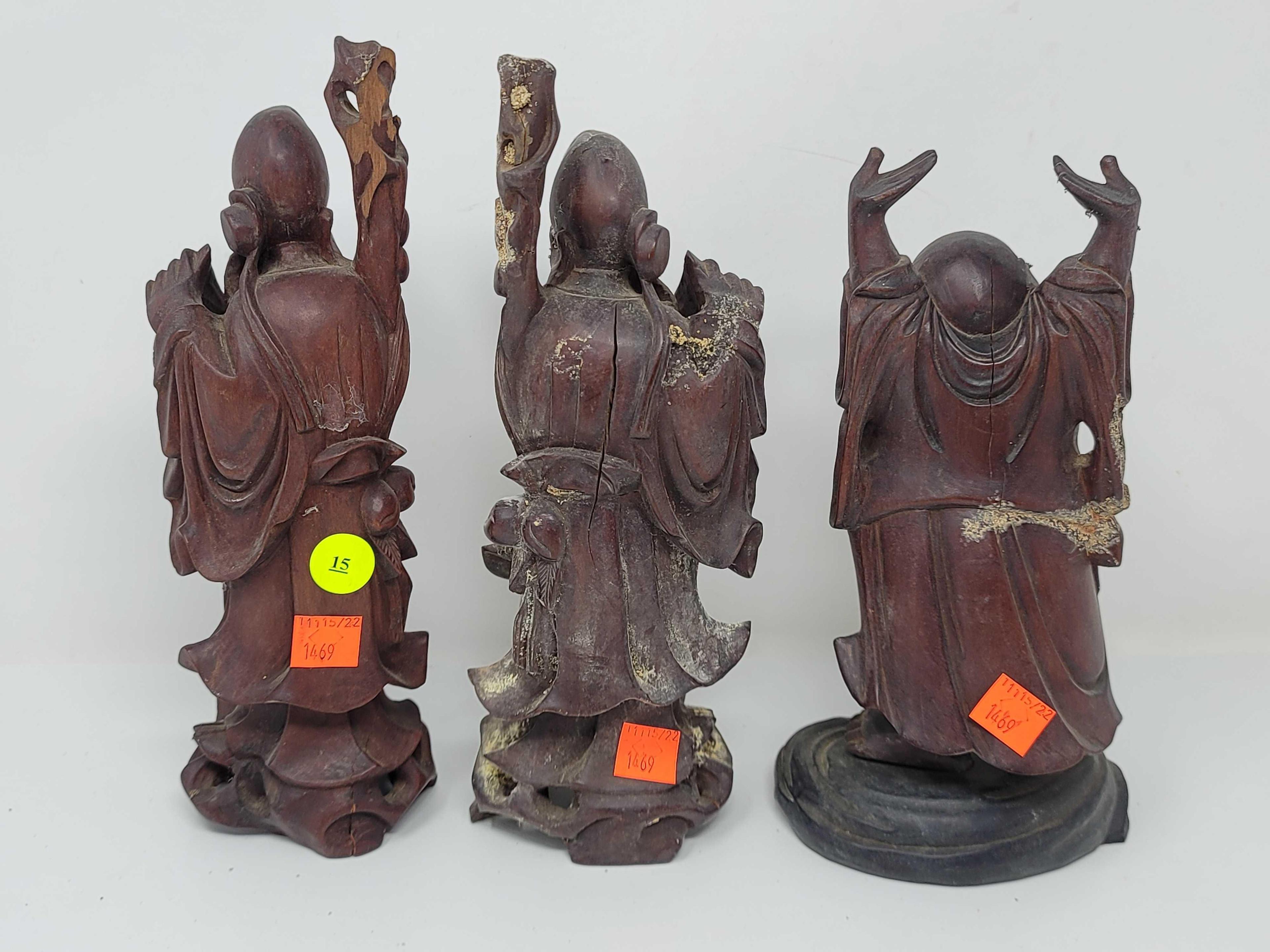 LOT OF 4 WOOD CARVED MAHOGANY ORIENTAL FIGURINES 1 IS 6 INCHES TALL AND 3 ARE 10 INCHES TALL
