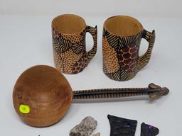 LOT OF THREE CARVED AFRICAN PIECES, TWO MUG WITH GIRAFFE MOTIF, AND ONE DIPPER IN GIRAFFE MOTIF AT