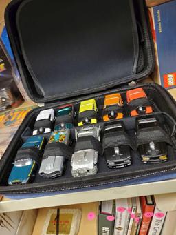 SOFT ZIP CASE FILLED WITH MISC DIECAST CAR MODELS, MUSCLE CARS, AND 1 POLICE CAR, PLEASE SEE THE