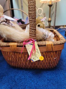 (RM1) LARGE WICKER BASKET WITH WRAPPED HANDLE AND SIDES. ALSO INCLUDES A HANDMADE SIGNED TEDDY BEAR,