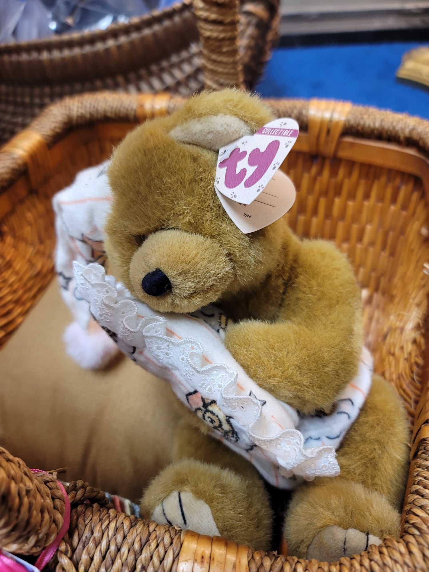 (RM1) LARGE WICKER BASKET WITH WRAPPED HANDLE AND SIDES. ALSO INCLUDES A HANDMADE SIGNED TEDDY BEAR,