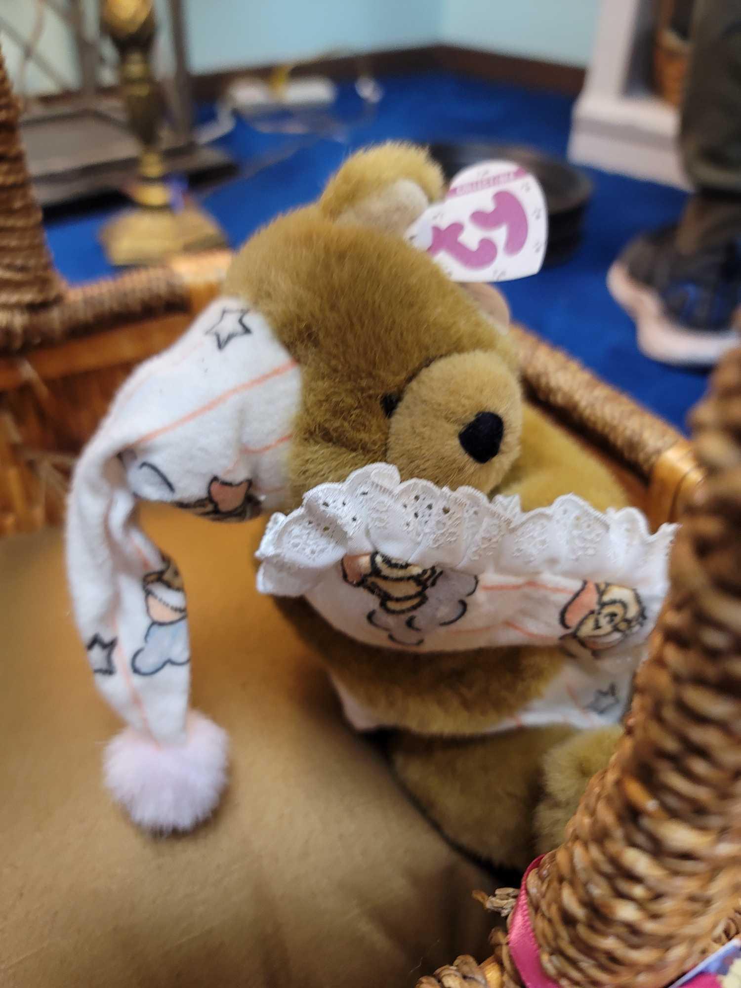 (RM1) LARGE WICKER BASKET WITH WRAPPED HANDLE AND SIDES. ALSO INCLUDES A HANDMADE SIGNED TEDDY BEAR,