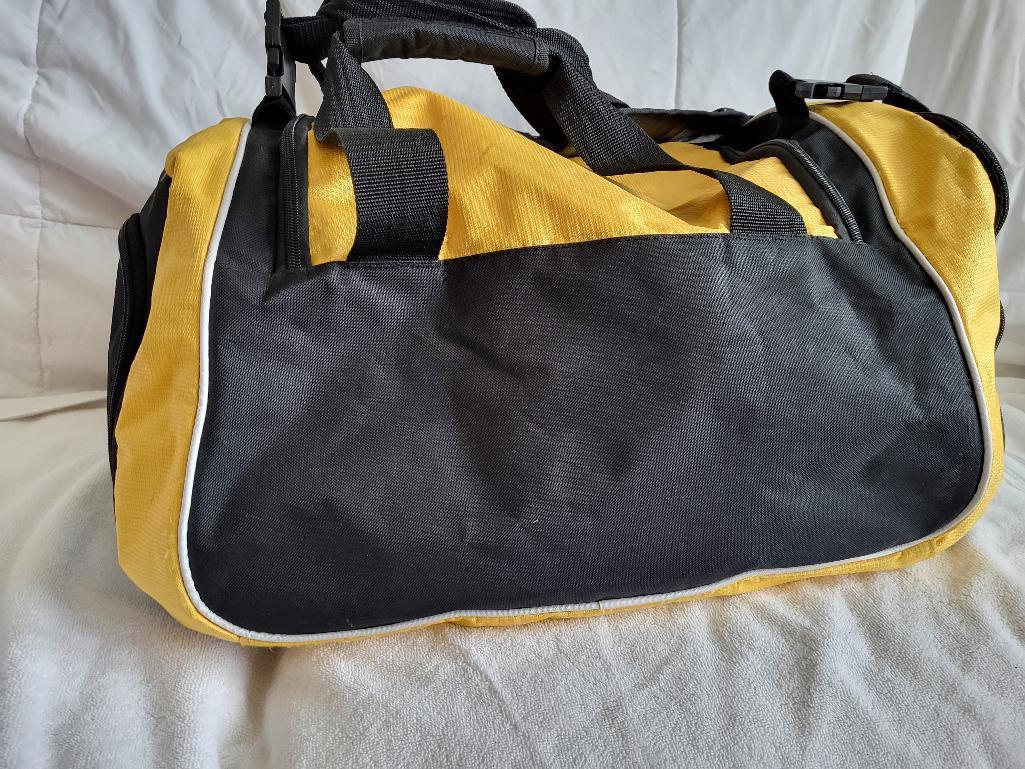 PITTSBURGH STEELERS DUFFLE BAG WITH COOLER SECTION ON THE SIDE. GREAT FOR TAILGATING. IS SOLD AS IS