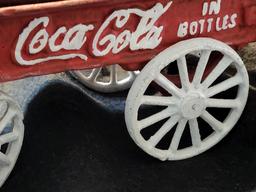 VINTAGE COCA COLA CAST IRON HORSE & DRAWN WAGON. ALSO, COMES WITH COCA COLA FANNY PACK. IS SOLD AS