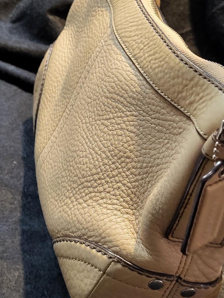 AUTHENTIC COACH EAST WEST SOFT DUFFLE TAN LEATHER SHOULDER BAG. NUMBER F12321. IS SOLD AS IS WHERE
