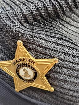 STRATTON POLICE HAT WITH HAMPTON SHERIFF'S OFFICE PIN. SELF FORMING. SIZE 7 3/8. IS SOLD AS IS WHERE