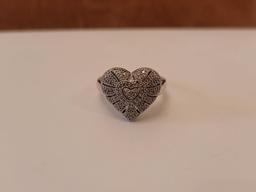 (DR) MARKED "925" STERLING SILVER HEART SHAPED RING, ACCENTED WITH SM. CZ CHIPS. IT WEIGHS APPROX.