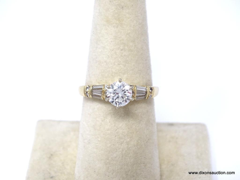 E.G.L. CERTIFIED 0.79 CT ROUND BRILLIANT CUT VVS2 DIAMOND MOUNTED IN 14 KT YELLOW GOLD RING. HAS