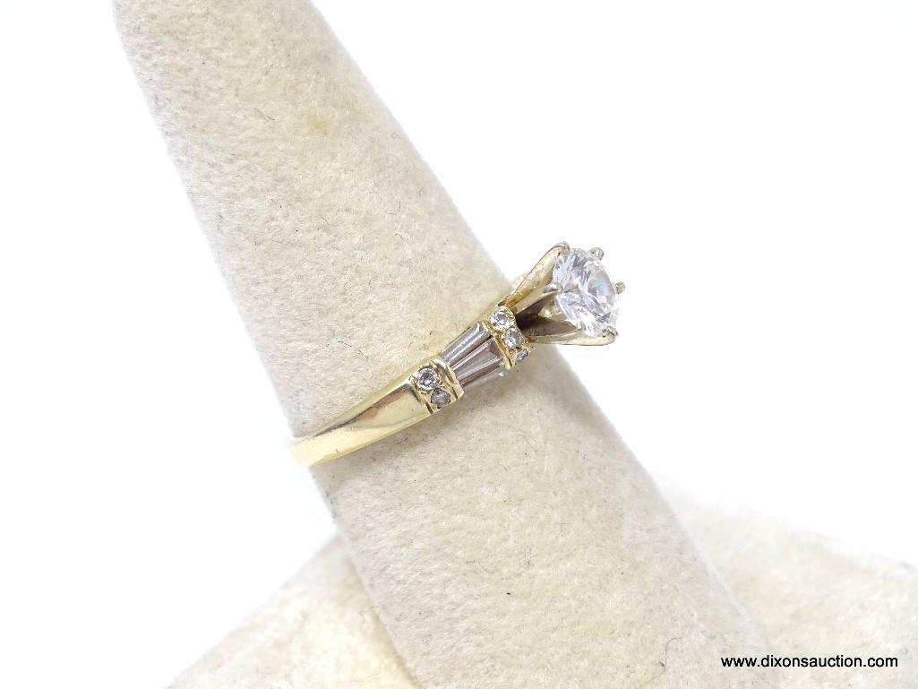 E.G.L. CERTIFIED 0.79 CT ROUND BRILLIANT CUT VVS2 DIAMOND MOUNTED IN 14 KT YELLOW GOLD RING. HAS