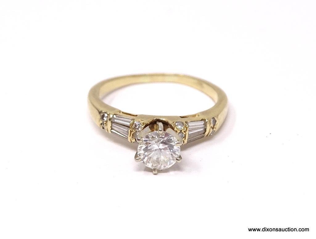 E.G.L. CERTIFIED 0.79 CT ROUND BRILLIANT CUT VVS2 DIAMOND MOUNTED IN 14 KT YELLOW GOLD RING. HAS