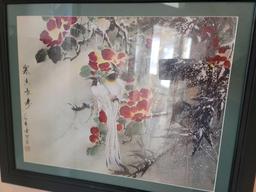 (LR) LOT OF 2 JAPANESE FRAMED FLORAL PRINTS. MATTED IN SAGE GREEN AND FRAMED IN A BLACK FRAME.