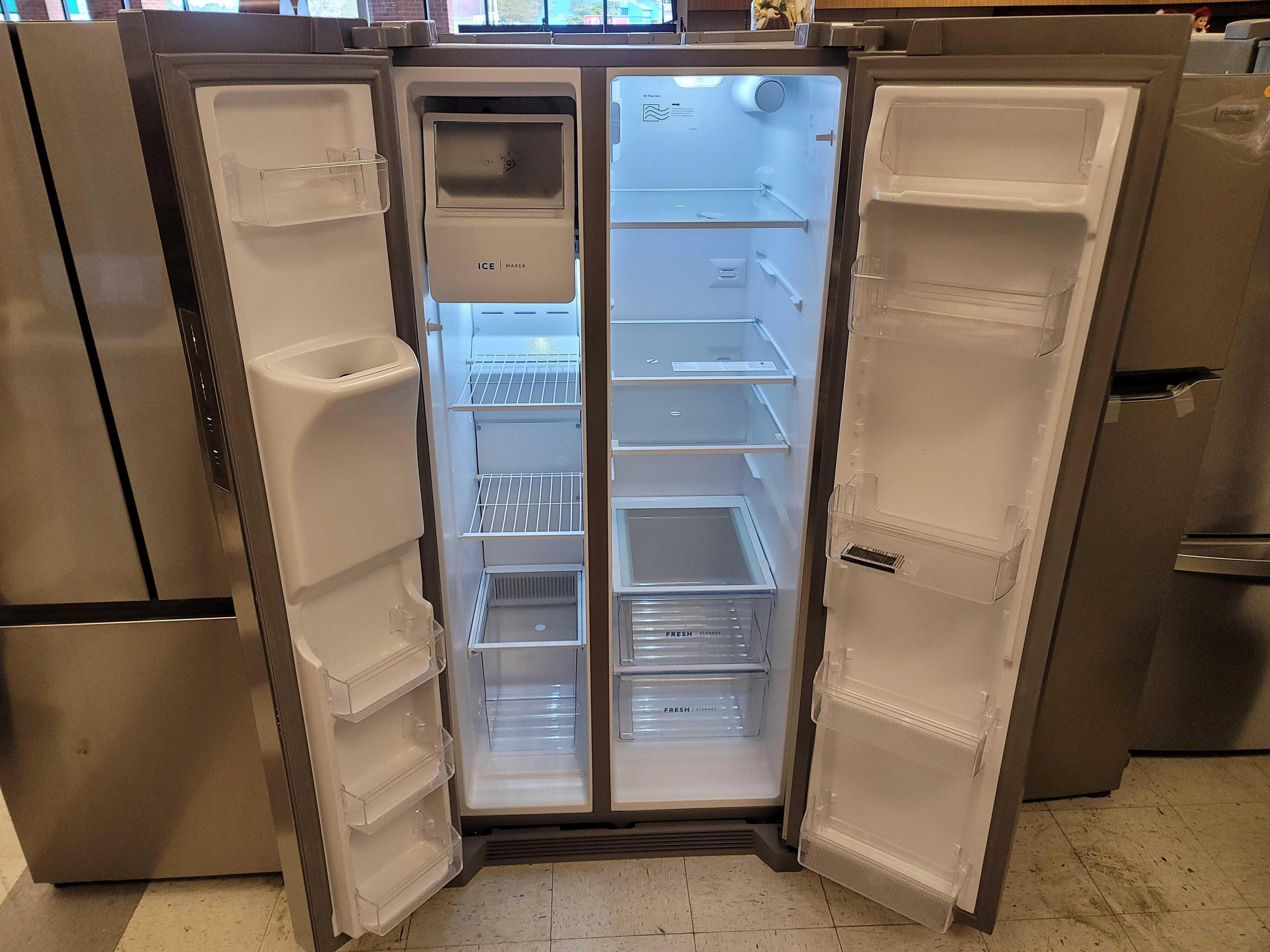 FRIGIDAIRE 33" 22.3 CU. FT. SIDE BY SIDE STAINLESS STEEL REFRIGERATOR WITH ICE MAKER. IT MEASURES