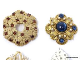 LOT OF (7) VINTAGE DECORATIVE BROOCHES TO INCLUDE A GOLD TONE LEAF/GREEN STONE BROOCH 2-1/2"L,