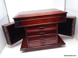 DARK STAINED LIFT TOP FOUR DRAWER JEWELRY CHEST WITH SIDES THAT OPEN. THE LIFT TOP OPENS UP TO A