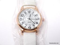 BRAND NEW ROSE GOLD TONE & WHITE QUARTZ WRIST WATCH WITH A MOTHER OF PEARL STYLE FACE & BOLD BLACK