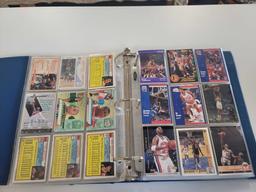 BLUE SPORTS CARD COLLECTION BINDER FILLED WITH ASSORTED BASKETBALL CARDS. INCLUDES PLAYERS SUCH AS:
