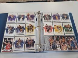 BLUE SPORTS CARD COLLECTION BINDER FILLED WITH ASSORTED BASKETBALL CARDS. INCLUDES PLAYERS SUCH AS: