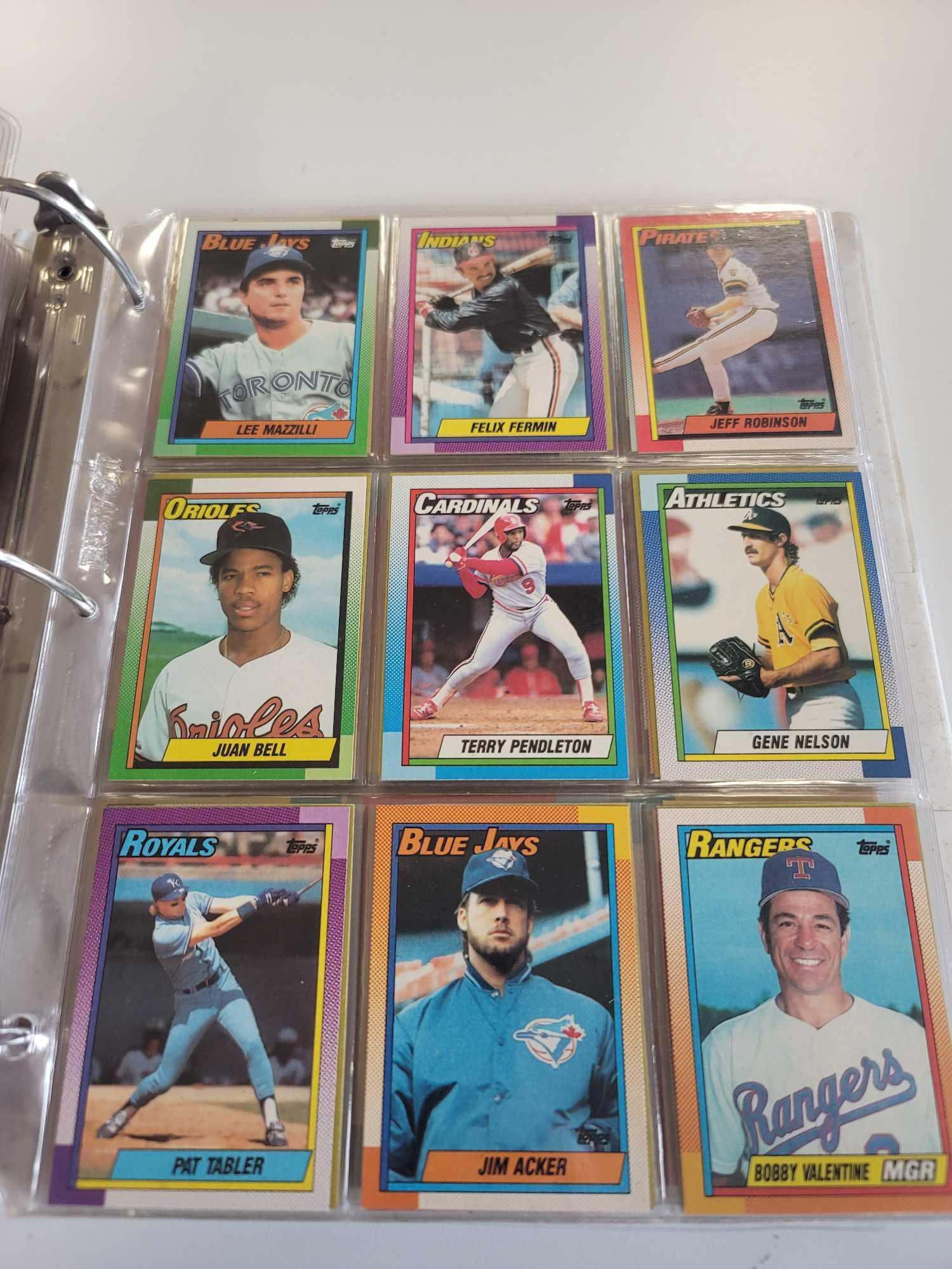 WHITE BINDER OF ASSORTED TOPPS BASEBALL CARDS. 52 PAGES FRONT AND BACK. INCLUDES PLAYERS SUCH AS: