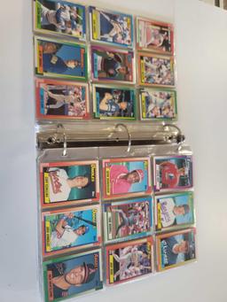 WHITE BINDER OF ASSORTED TOPPS BASEBALL CARDS. 52 PAGES FRONT AND BACK. INCLUDES PLAYERS SUCH AS: