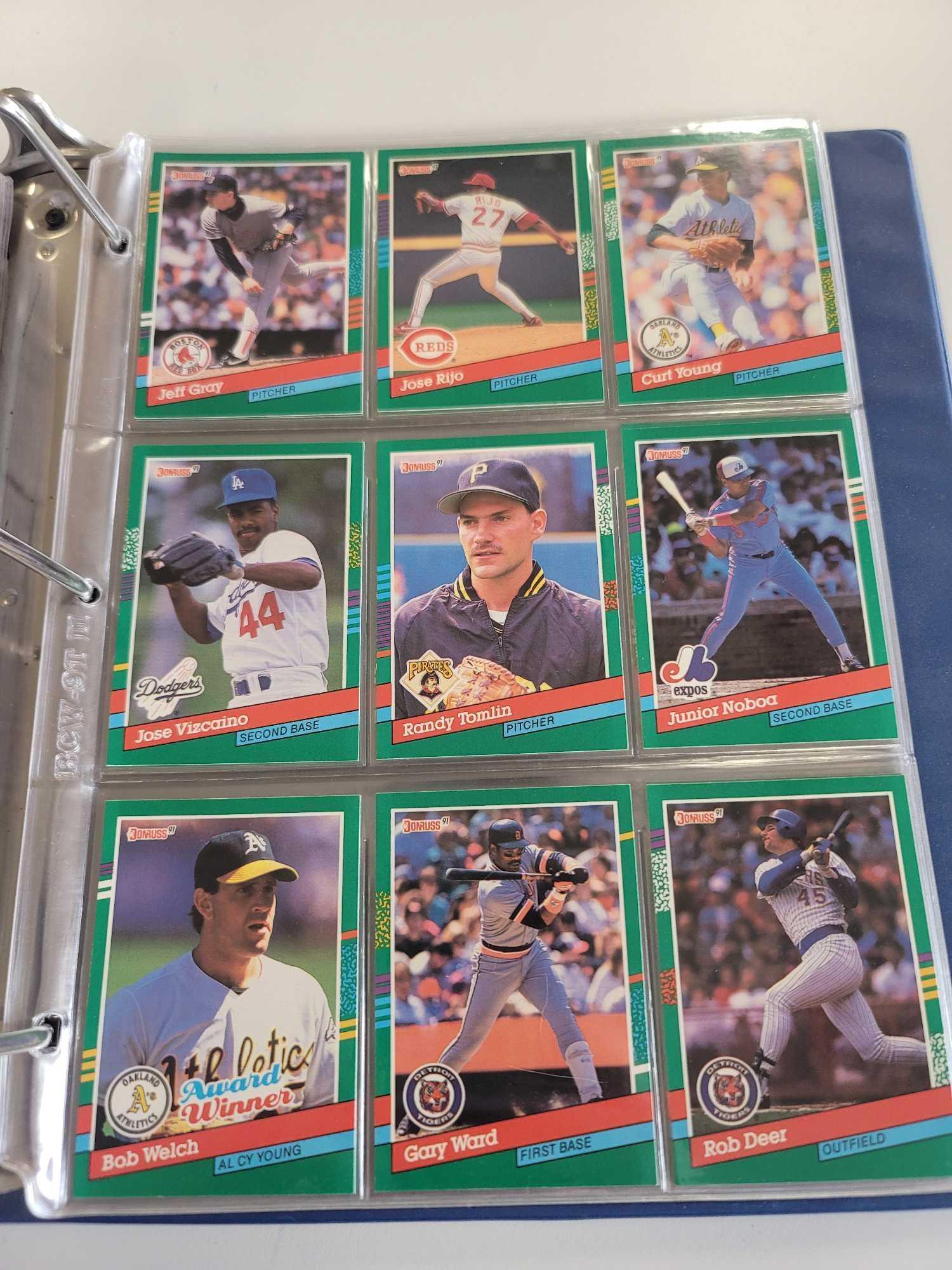 BLUE BASEBALL CARD ALBUM BINDER FILLED WITH ASSORTED BASEBALL CARDS. INCLUDES PLAYERS SUCH AS: DAVE