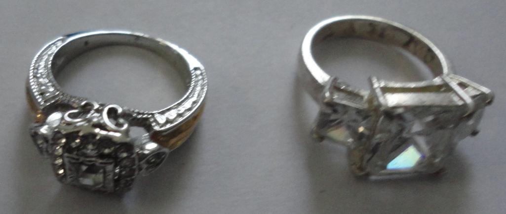 2 STERLING RINGS WITH CLEAR STONES ALL ITEMS ARE SOLD AS IS, WHERE IS, WITH NO GUARANTEE OR