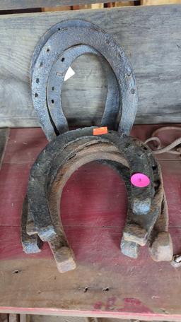 LOT OF ASSORTED EARLY STYLE HORSE SHOES AND HORSE BITS