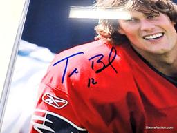 UNFRAMED & AUTOGRAPHED PHOTO OF TOM BRADY. COMES WITH A PLASTIC PROTECTIVE SLEEVE. IT MEASURES