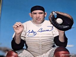 FRAMED & AUTOGRAPHED PHOTO OF YOGI BERRA. DISPLAYED IN A BLACK AND SILVER FRAME. IT MEASURES APPROX.