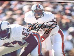 FRAMED & AUTOGRAPHED PHOTO OF DAN MARINO. DISPLAYED IN A BLACK AND SILVER FRAME. IT MEASURES APPROX.