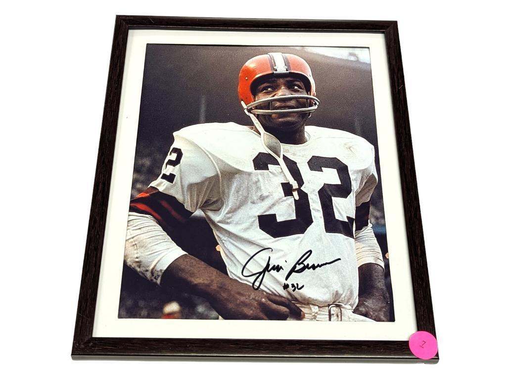 FRAMED & AUTOGRAPHED PHOTO OF JIM BROWN. DISPLAYED IN A BROWN FRAME. IT MEASURES APPROX. 9-1/2" X