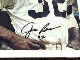 FRAMED & AUTOGRAPHED PHOTO OF JIM BROWN. DISPLAYED IN A BROWN FRAME. IT MEASURES APPROX. 9-1/2" X