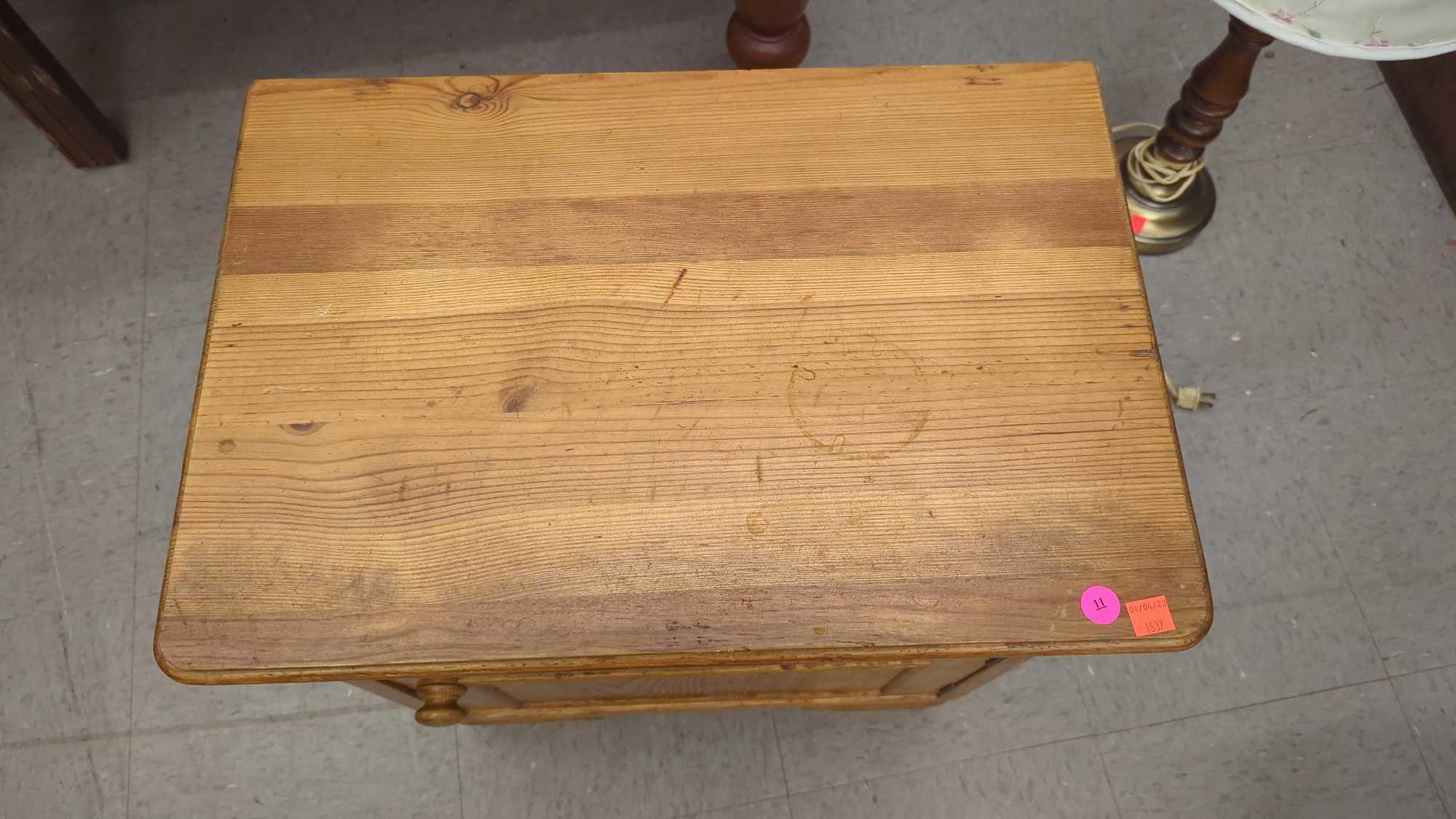 WOODEN SIDE TABLE ONE DRAWER OVER ONE DOOR, MEASURES APPROXIMATELY 20 IN X 14 IN X 22 IN, DRAWER IS