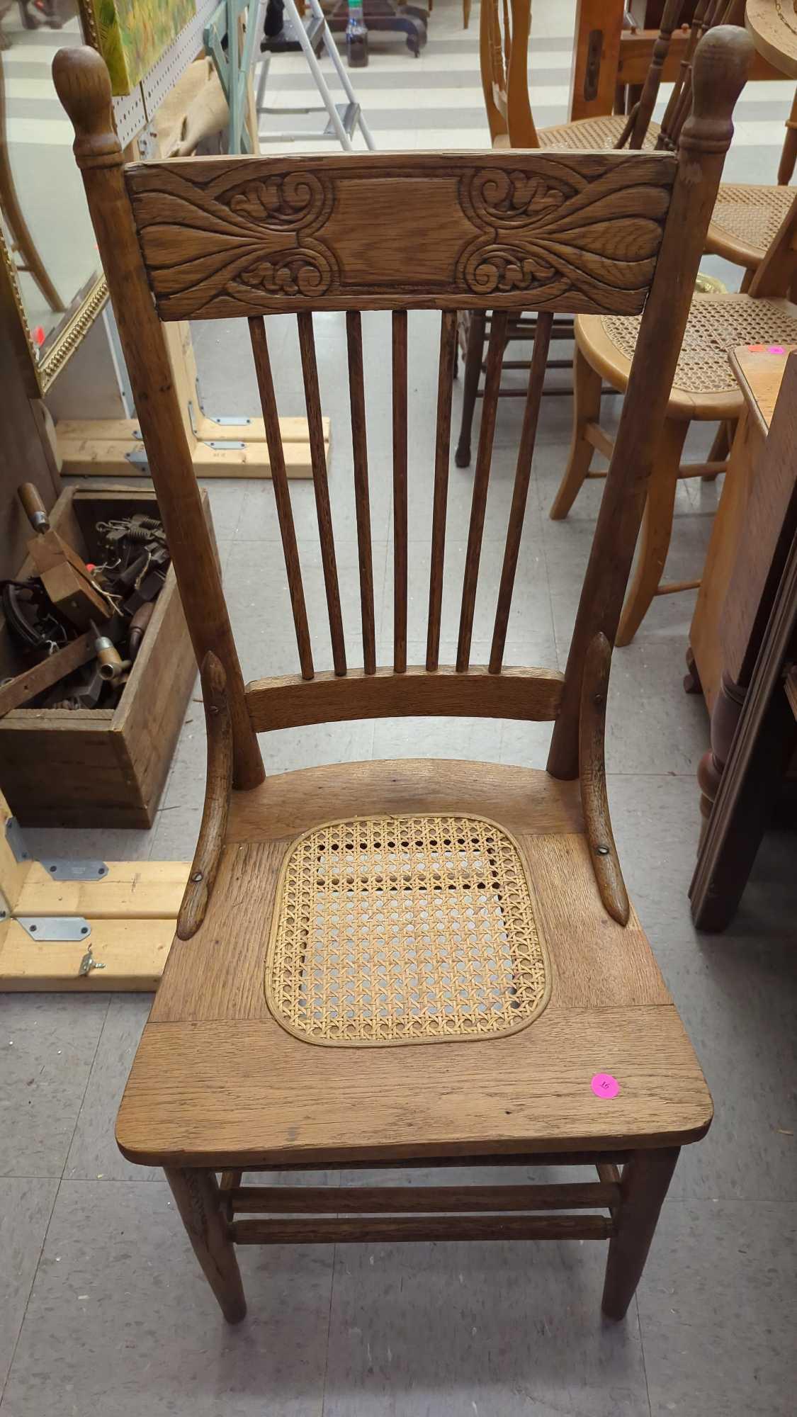 EARLY STYLE WOODEN PRESS BACK DINING CHAIR WITH A WICKER BOTTOM MEASURES APPROXIMATELY 17 IN X 15 IN