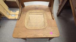 EARLY STYLE WOODEN PRESS BACK DINING CHAIR WITH A WICKER BOTTOM MEASURES APPROXIMATELY 17 IN X 15 IN