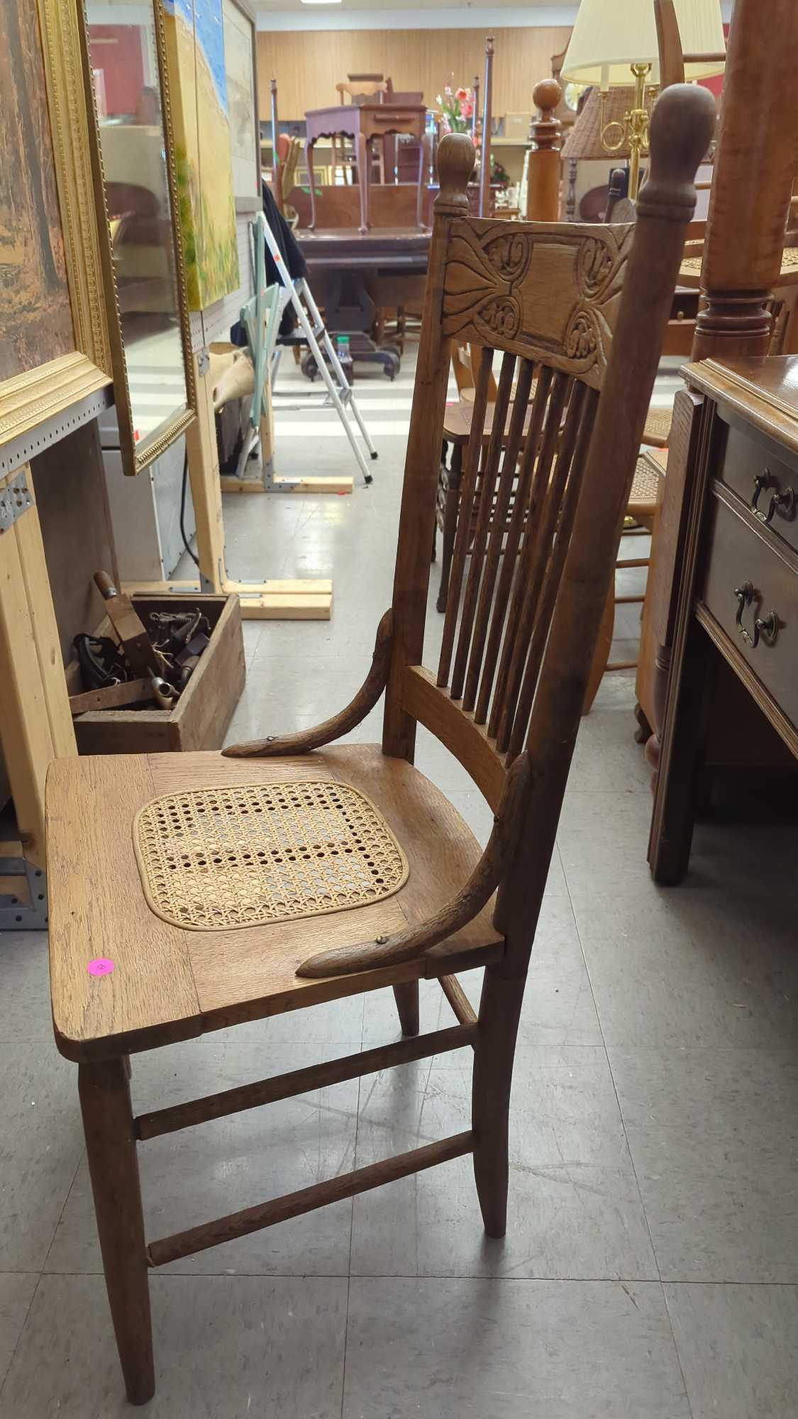 EARLY STYLE WOODEN PRESS BACK DINING CHAIR WITH A WICKER BOTTOM MEASURES APPROXIMATELY 17 IN X 15 IN