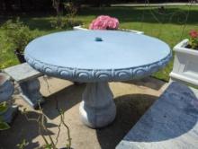 (BP) ROUND SOLID CONCRETE OUTDOOR PATIO TABLE WITH SWIRL DESIGNED CONCRETE BASE. IT HAS AN AREA FOR