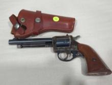 H&R GARDNER .22 CALIBER REVOLVER. MODEL 676. COMES WITH BROWN LEATHER HOLSTER. HAS TARNISH ON