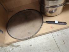 Shelf lot of seven assorted items, including five pots in different sizes, one large lid for a pan/