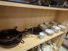 Shelf lot of 62 assorted items including six cast iron skillets, two standing picture display in the